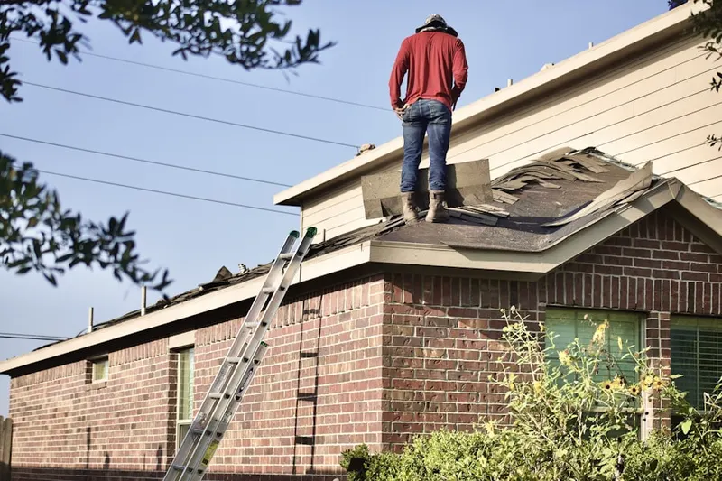 Professional roofer working on a residential roof in Tranquility Park